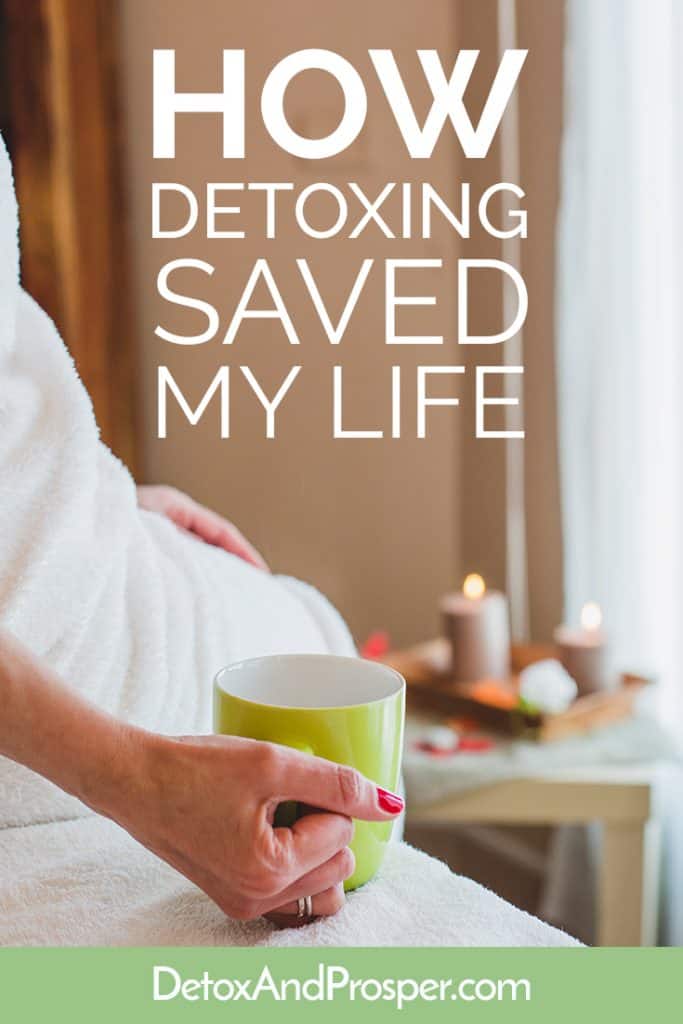 woman in towel drinking detox tea from a green cup