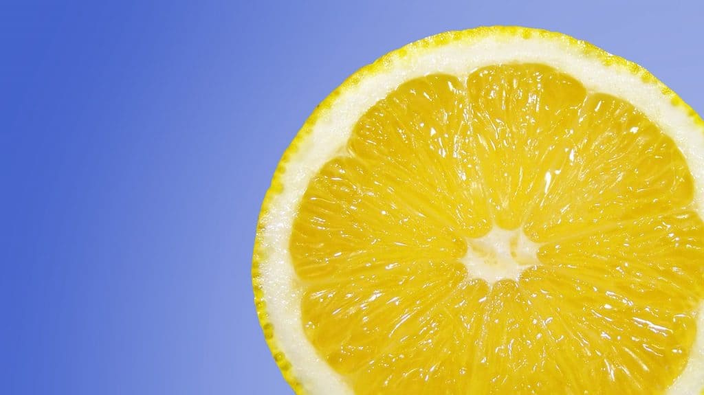 a yellow lemon against a blue background