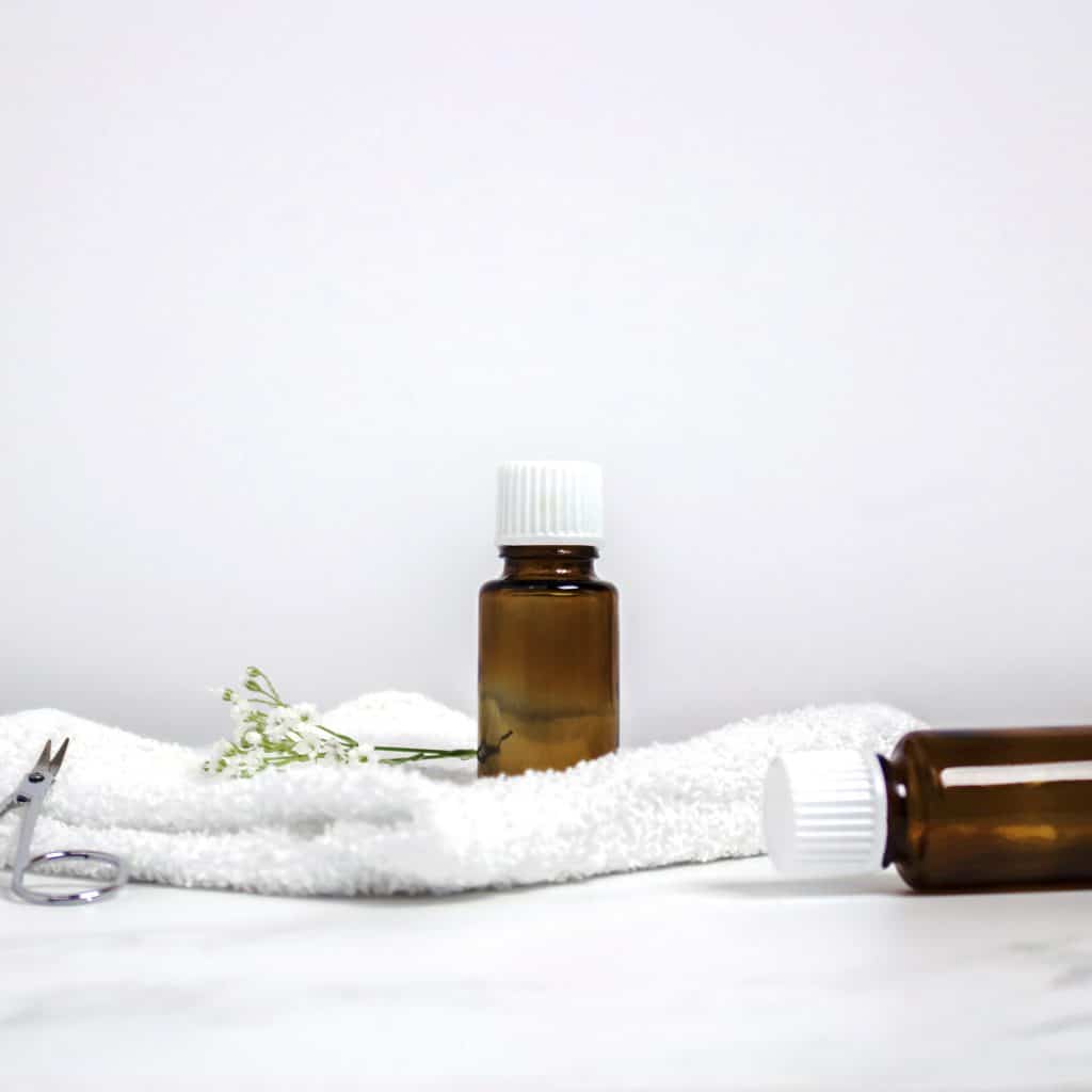 a white towel and detoxifying essential oils