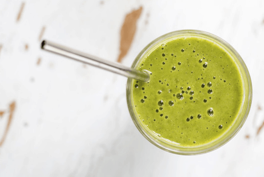 green detox drink with straw