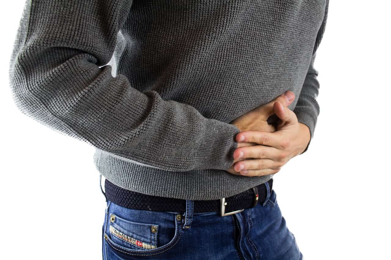 A man with stomach pain caused by sibo